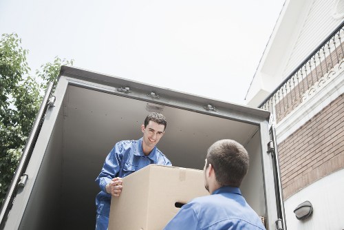 Professional man in uniform assisting with moving in Kingston upon Thames